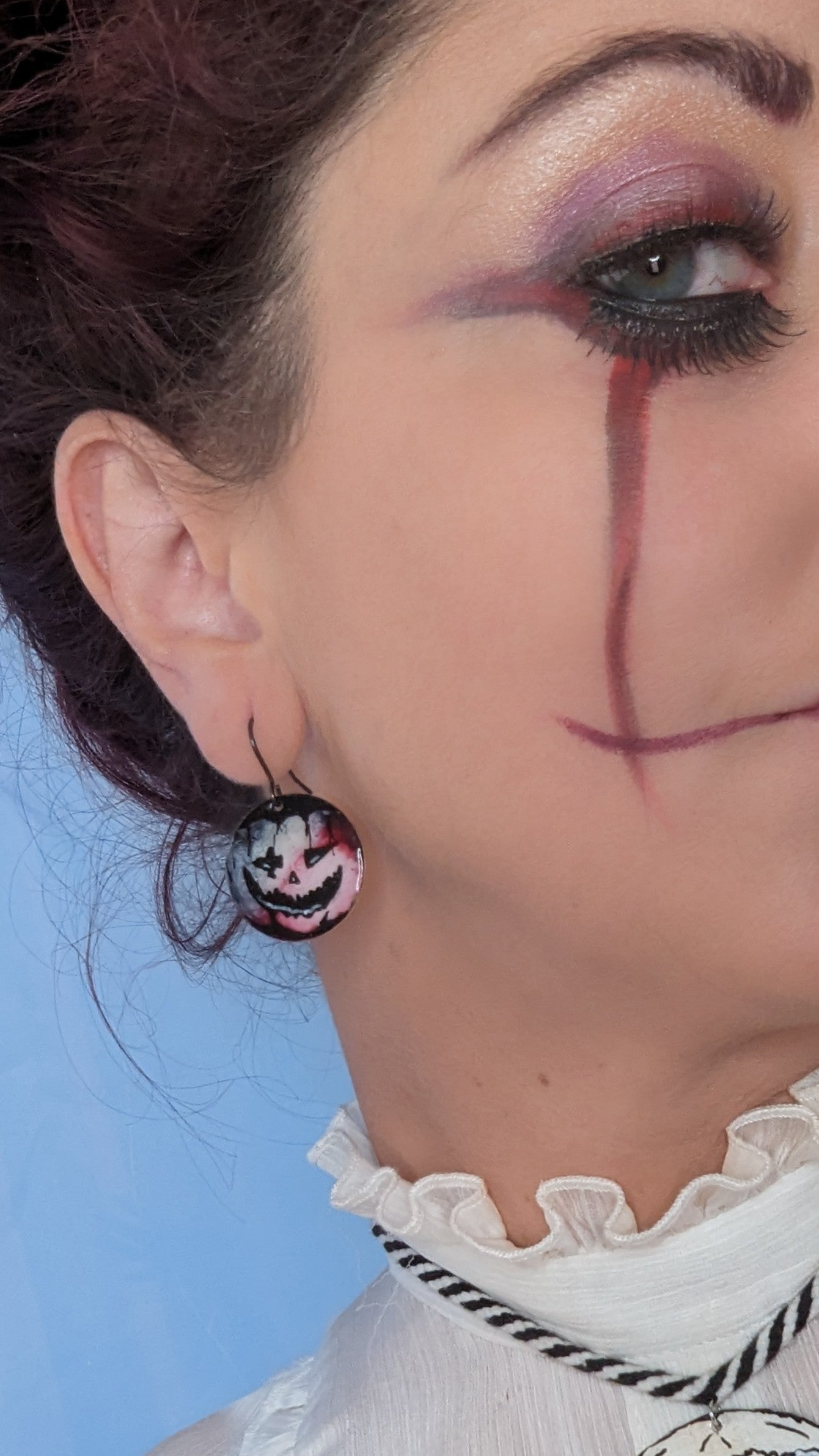 Model wearing pumpkin earrings. Halloween Jewellery