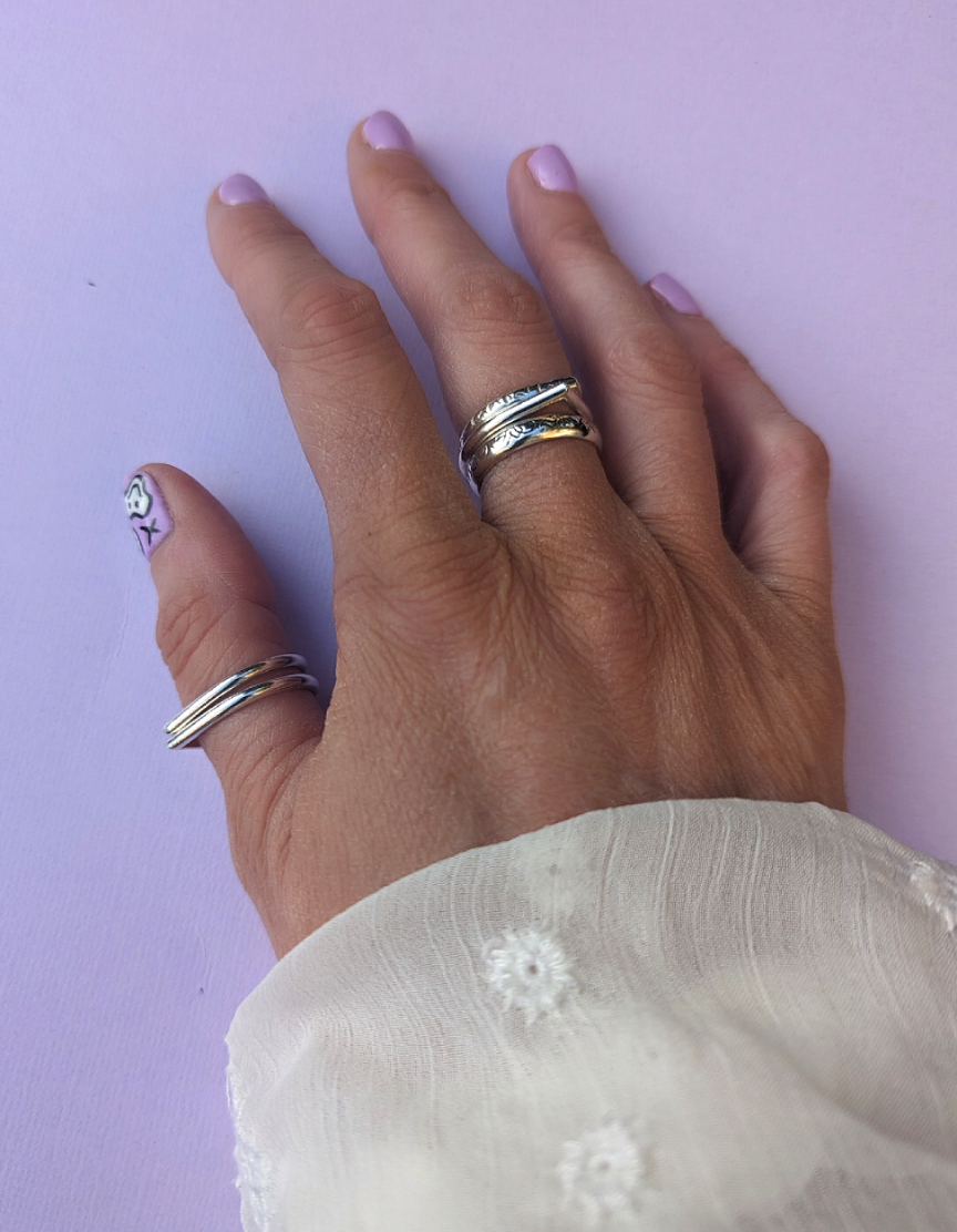Hand modeling tear drop goddess rings.