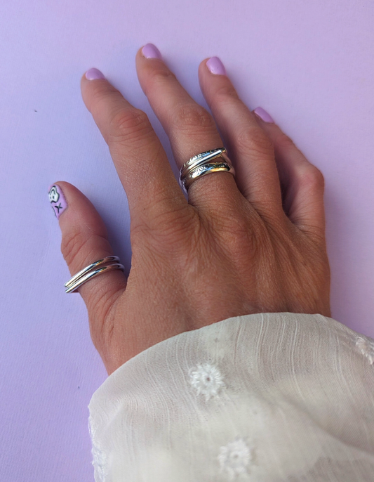 Hand modeling tear drop goddess rings.