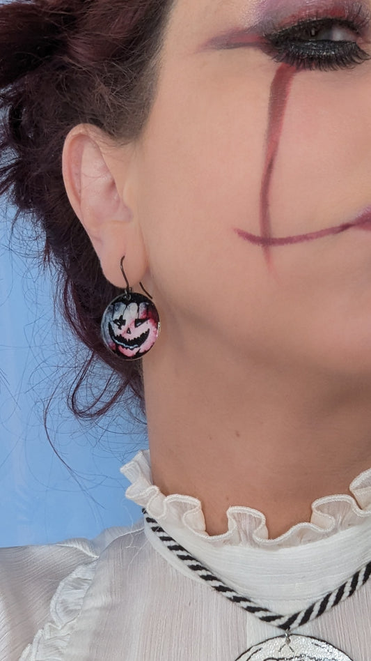 Model wearing punkin earrings. Halloween Jewellery 