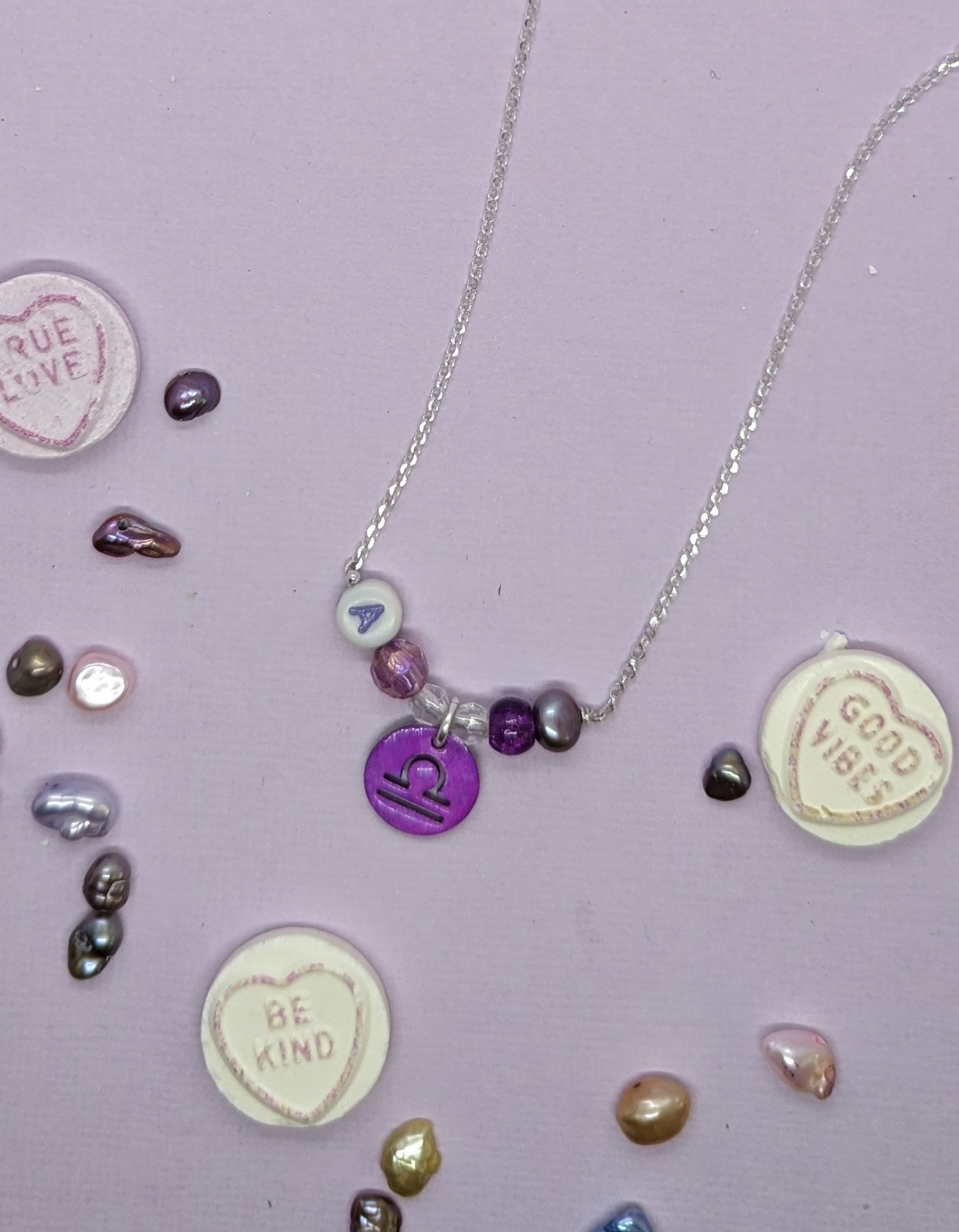 Libra star sign personalised necklace in purple. 