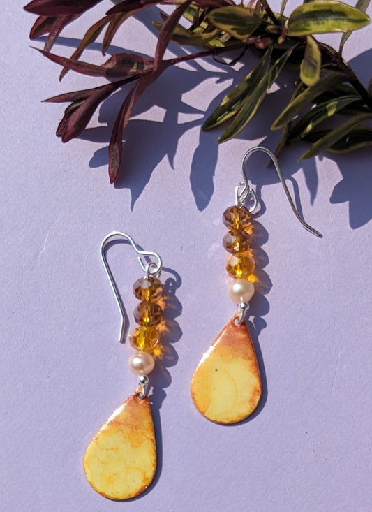 Warm yellow earrings and sparkling crystals 