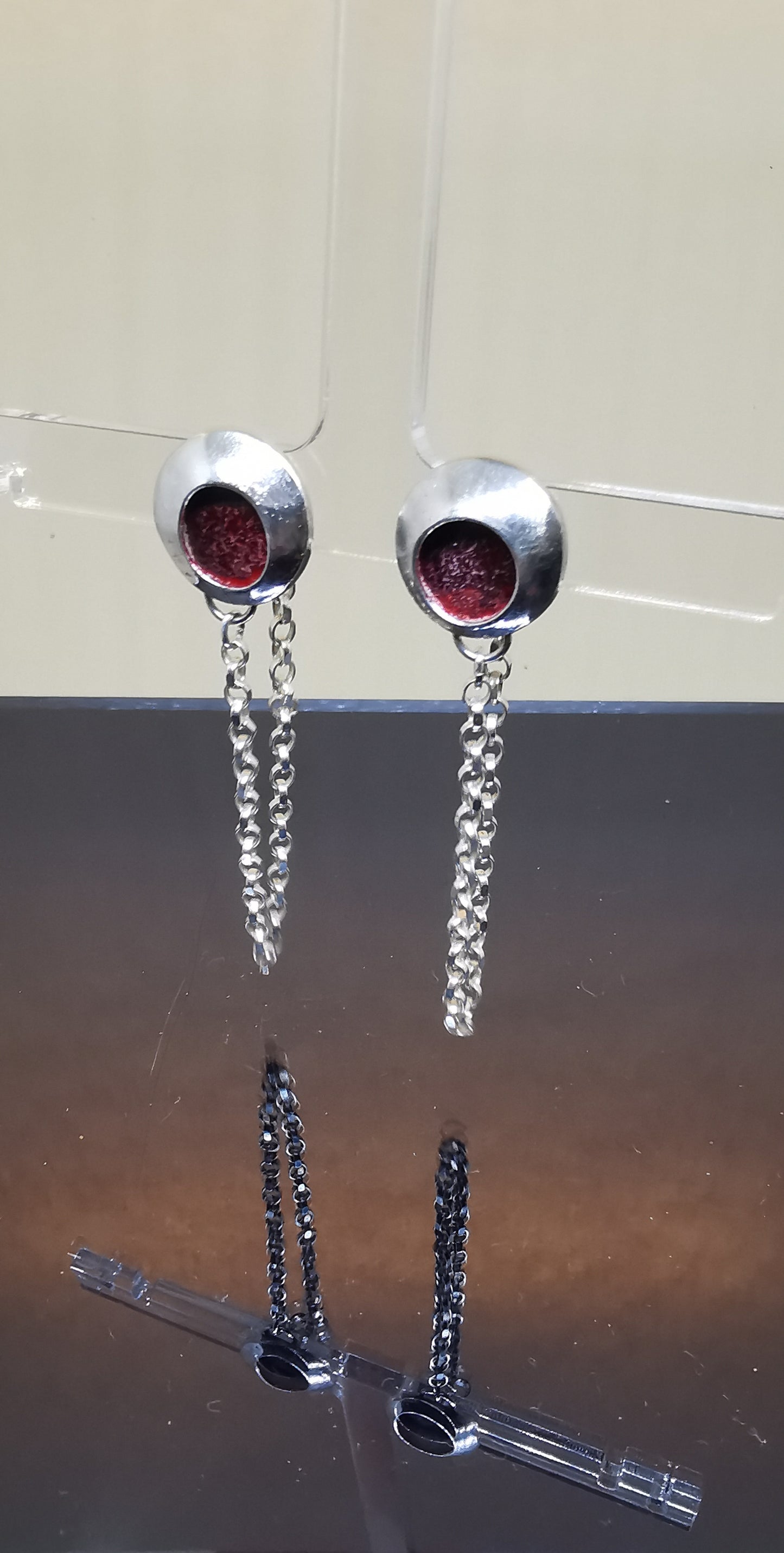 Red enamal and silver earrings.